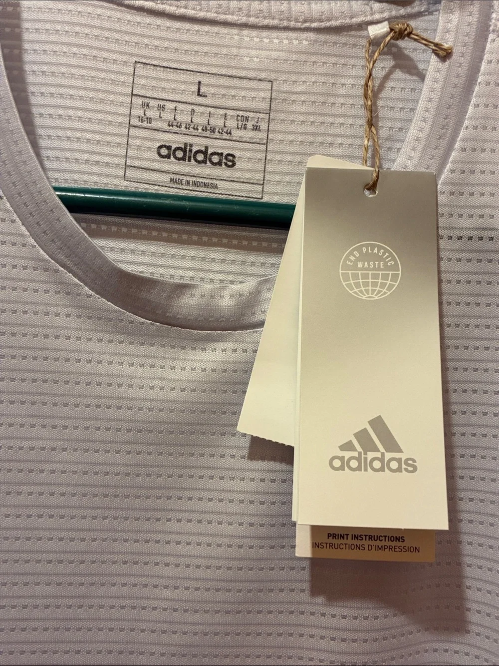 adidas Aeroready Men’s running tee in a light gray and signature stripes.